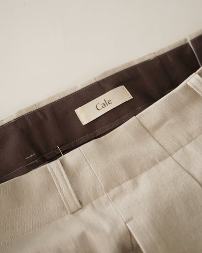 Cale-nidom chino two tuck trousers